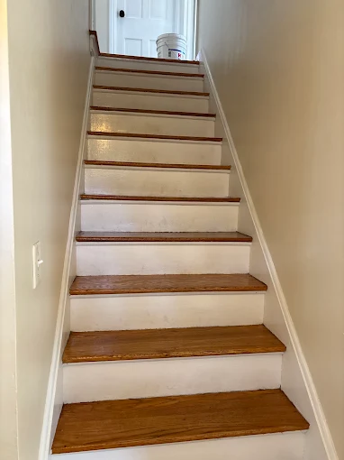 The staircase after tread sanding and refinishing