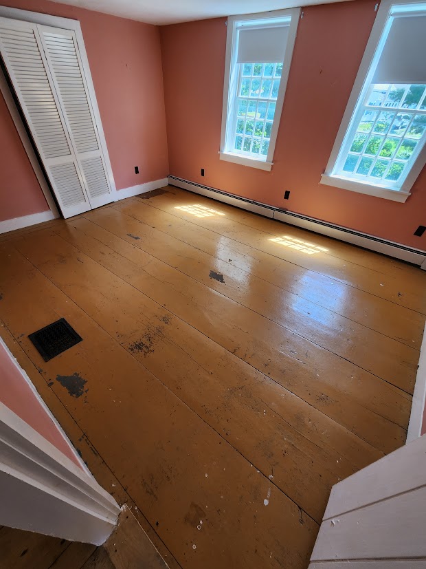 The painted bedroom floor before restoration