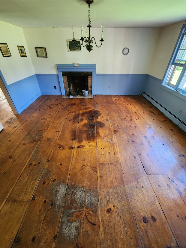 The fireplace room floor before restoration